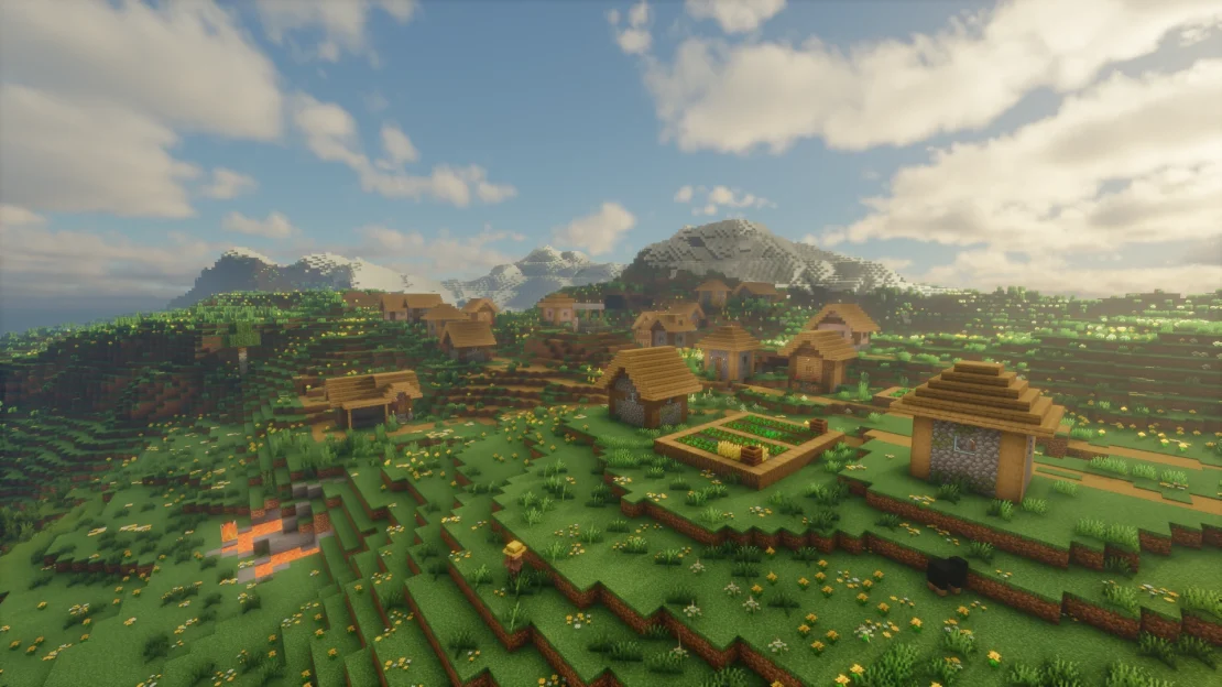 minecraft village in a meadow with snowy mountains