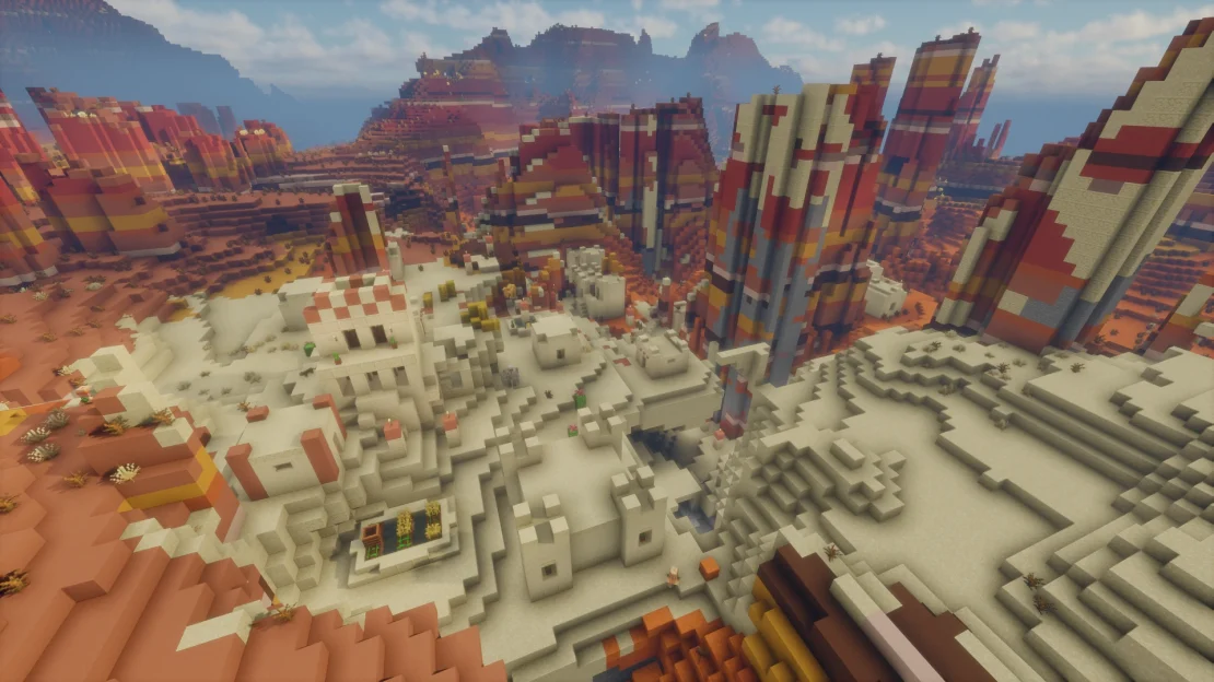 minecraft desert village surrounded by eroded badlands