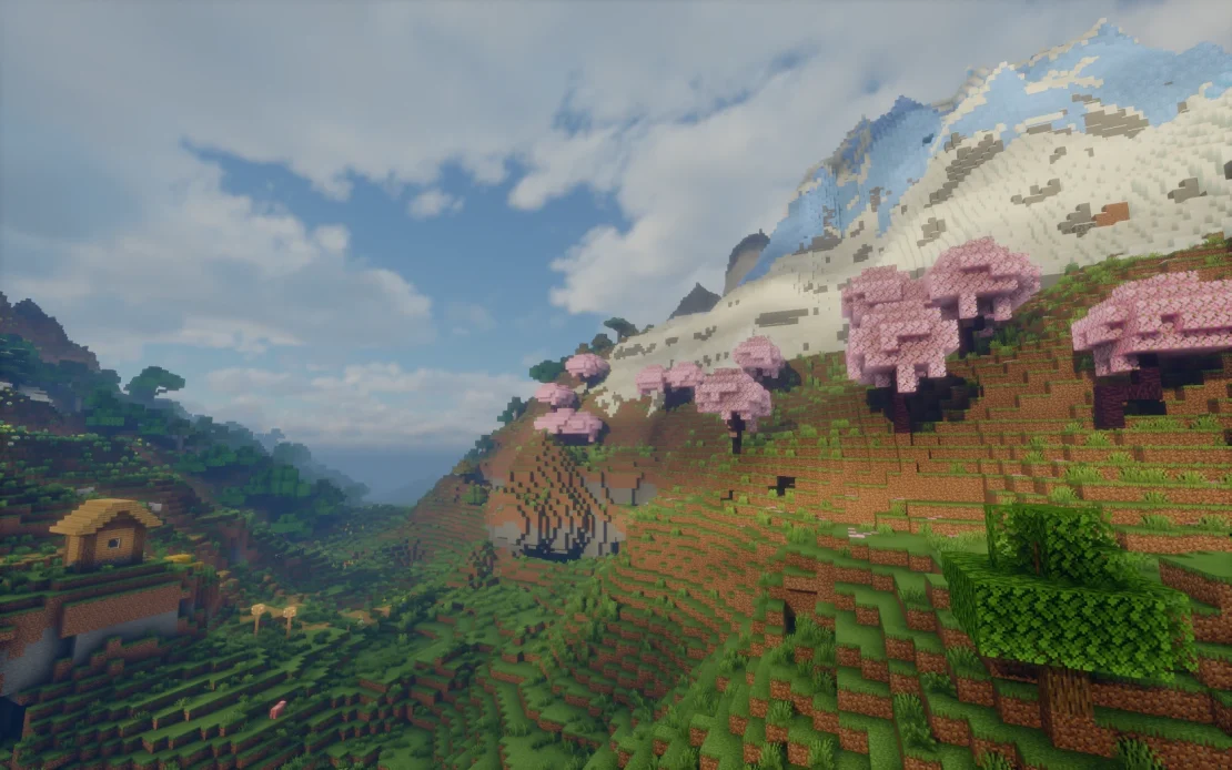massive mountain covered with cherry grove trees in minecraft