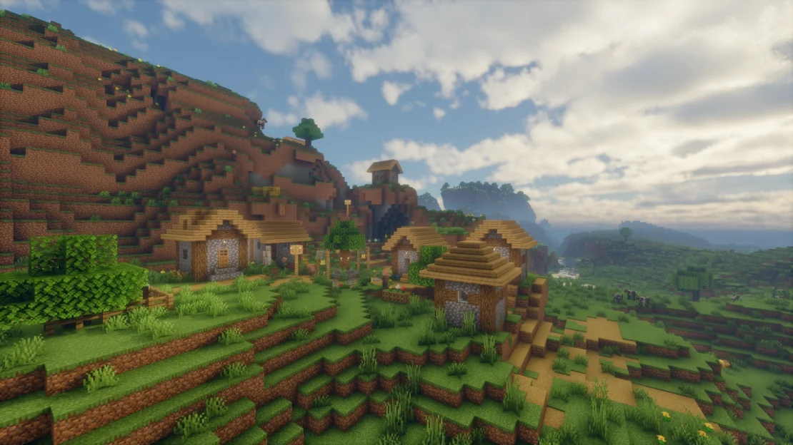 Spawn near a peaceful Meadow Village surrounded by beautiful hills in Minecraft