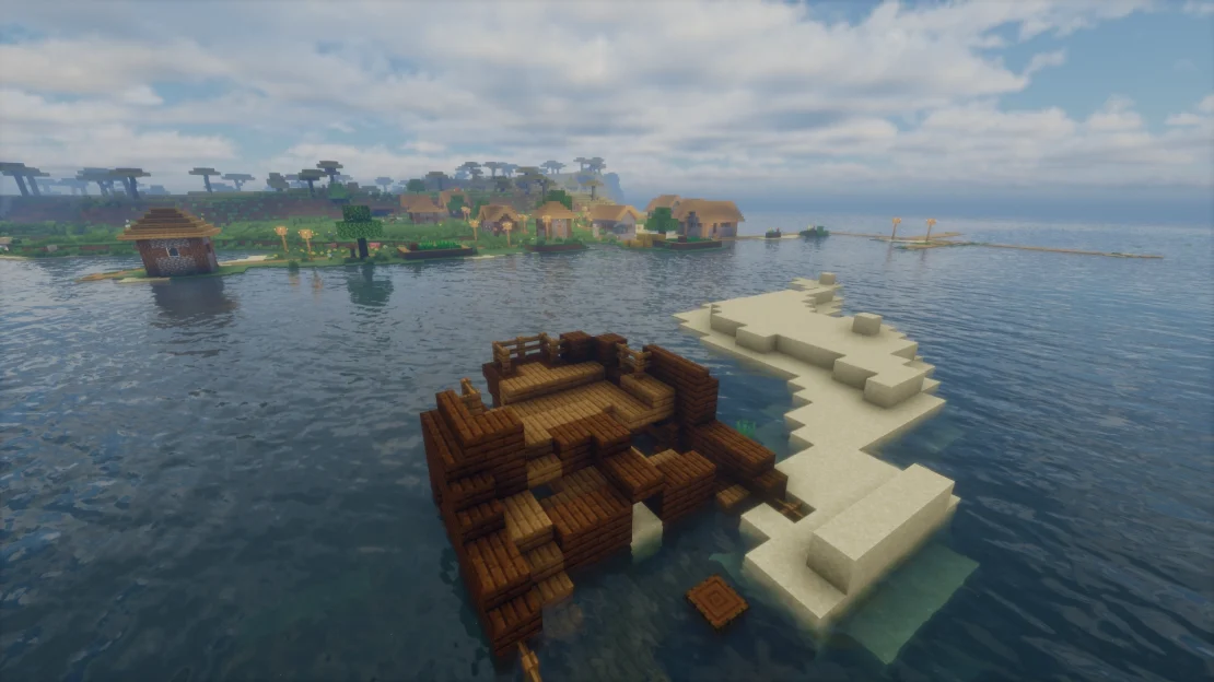 Spawn near a village with a shipwreck right next to it in Minecraft