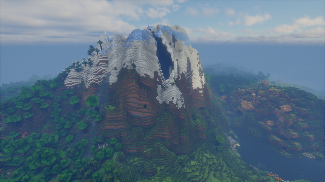 Giant lone snowy mountain towering above a nearby village in Minecraft